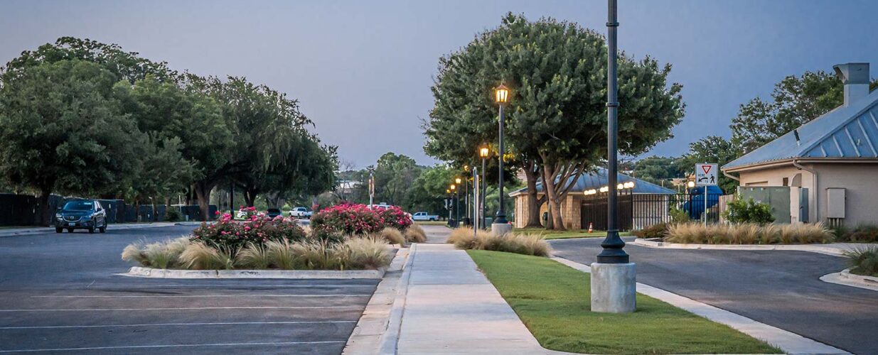 Marble Falls parking lot with street lights at dusk