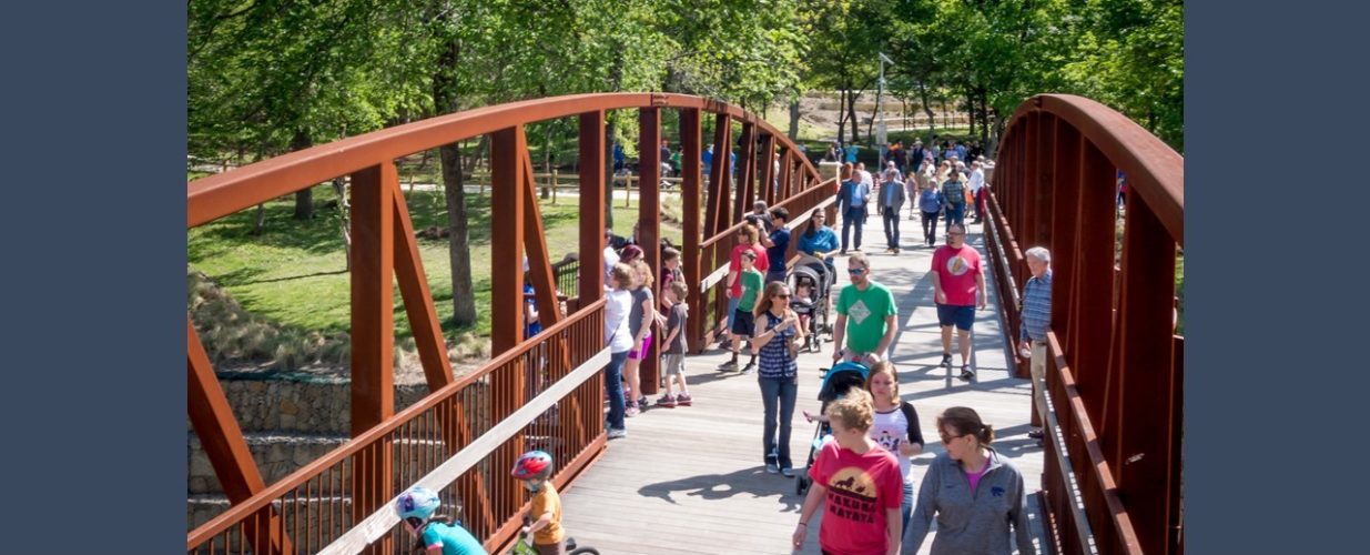 people on bridge at Historic Water Station Park in Allen, TX